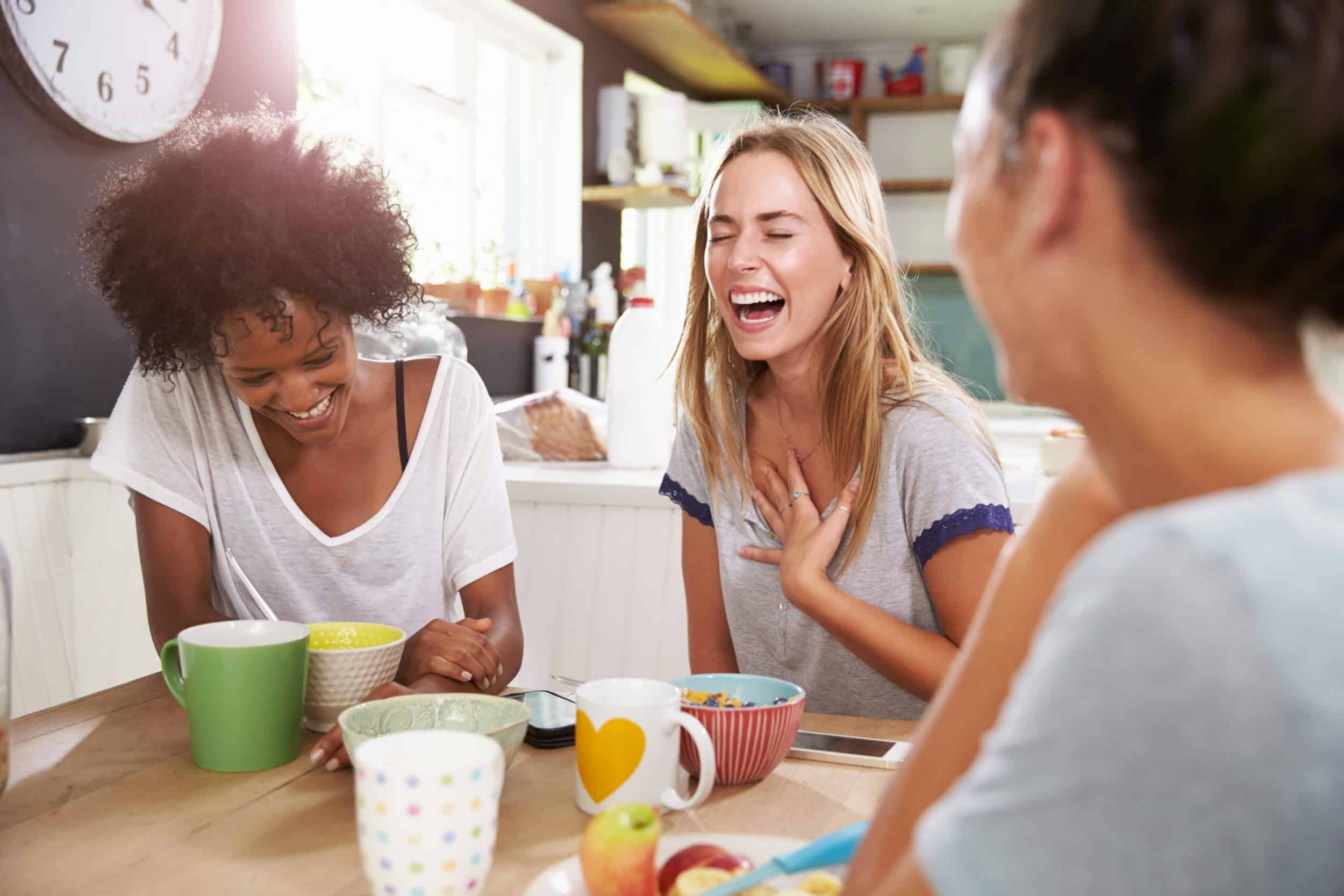 Three Female Friends Enjoying Breakfast At Home Together