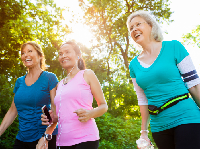 Three women exercising outside