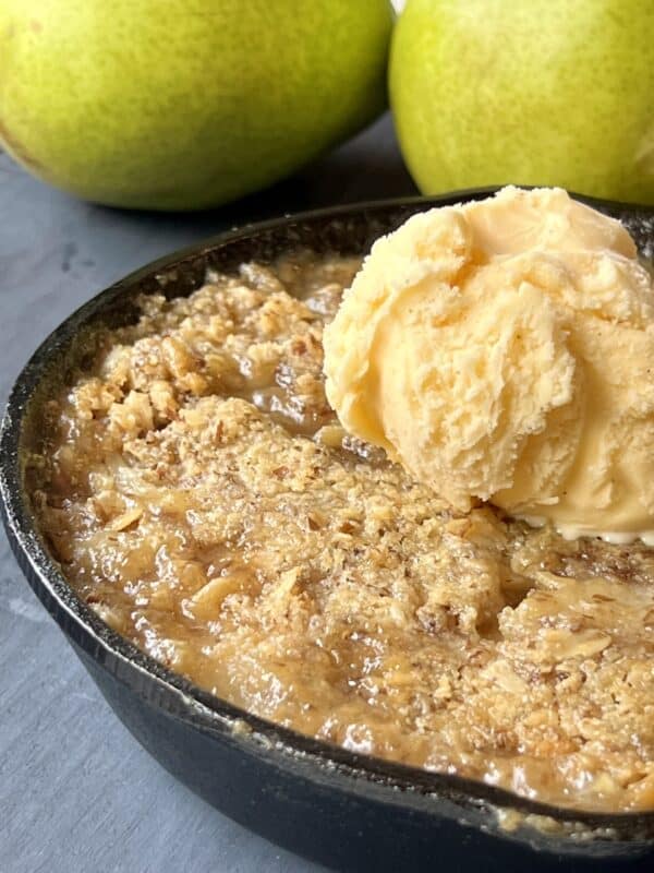 Cardamom Pear Crisp topped with vanilla ice cream