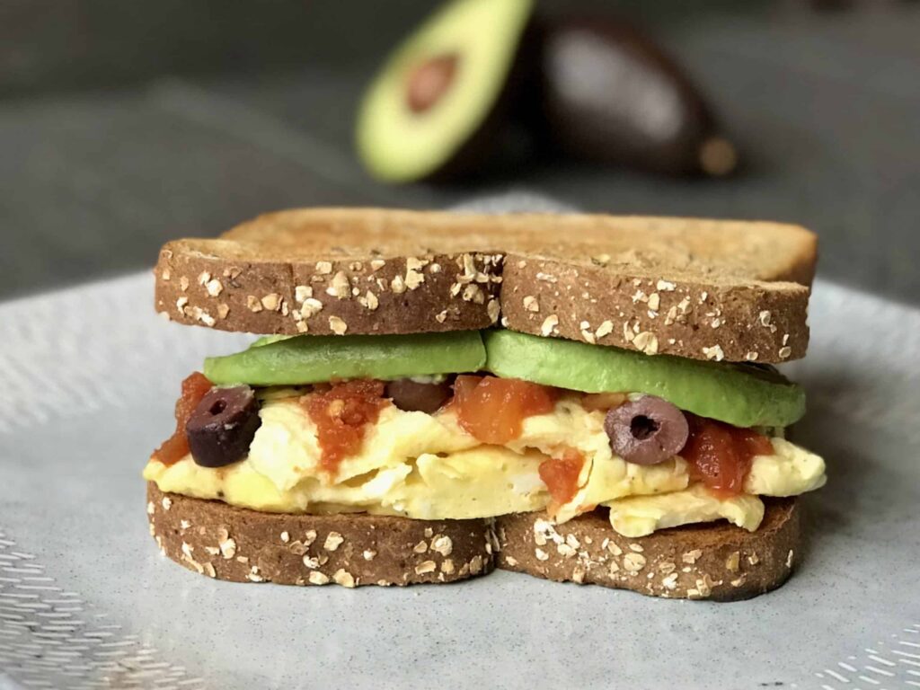 Southwestern Breakfast Sandwich, eggs, olives, salsa and avocado