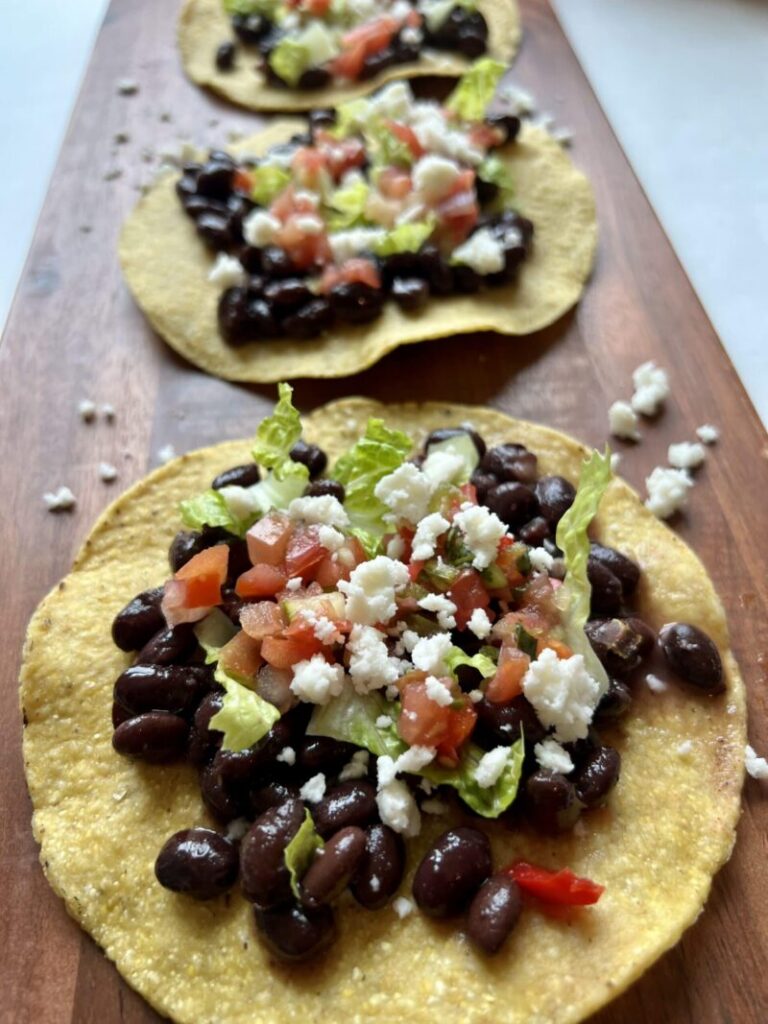 Summer Crispy Tostada, black beans, lettuce and salsa